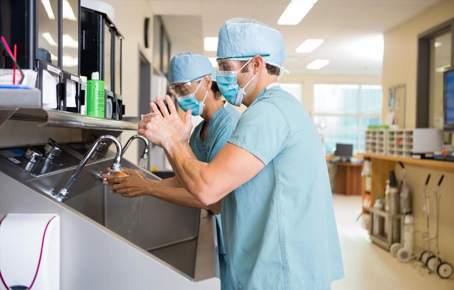 Doctors washing their hands in hospital.