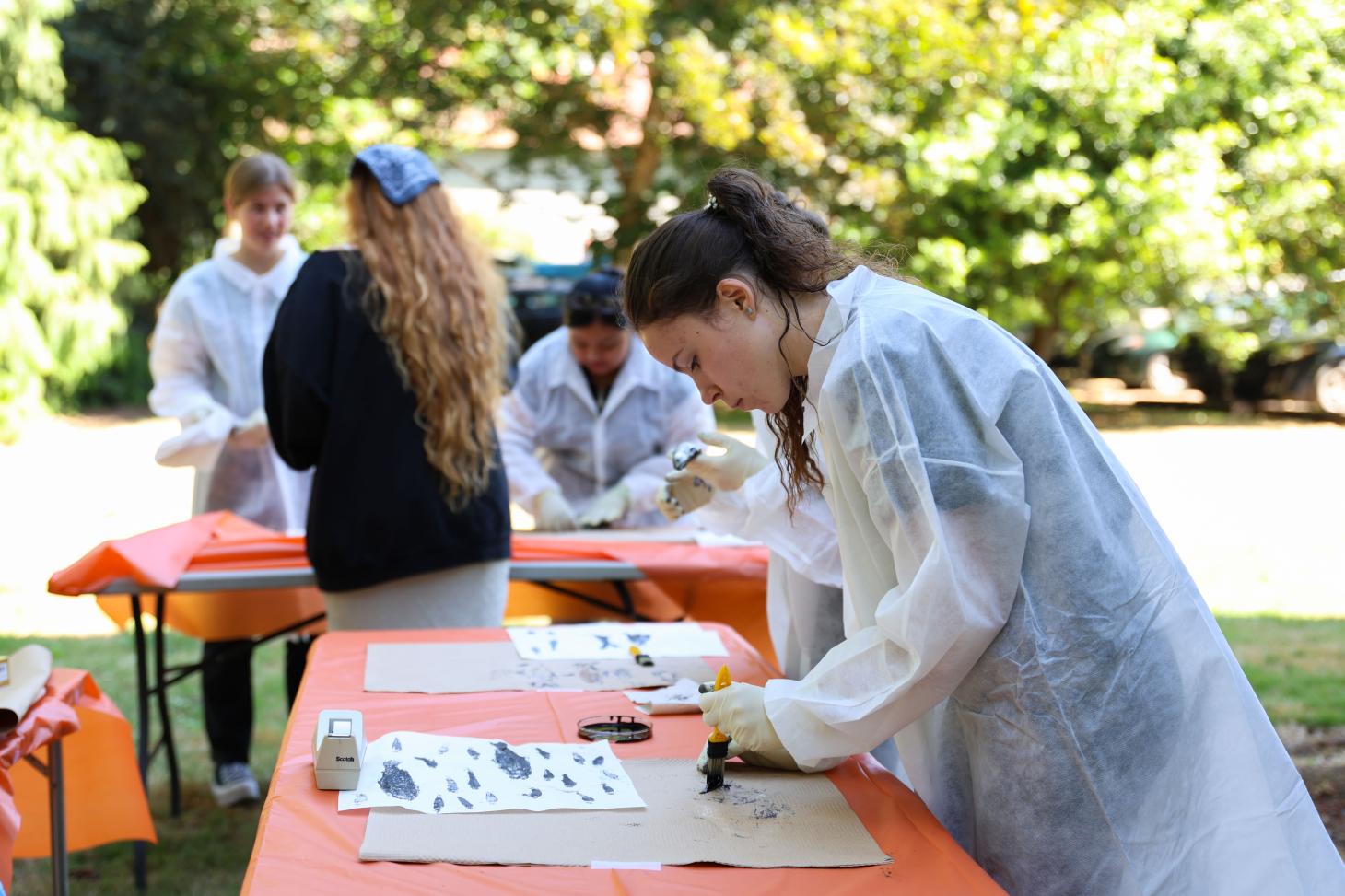 A student creates fish ink prints at the Pernot Microbiology Camp.
