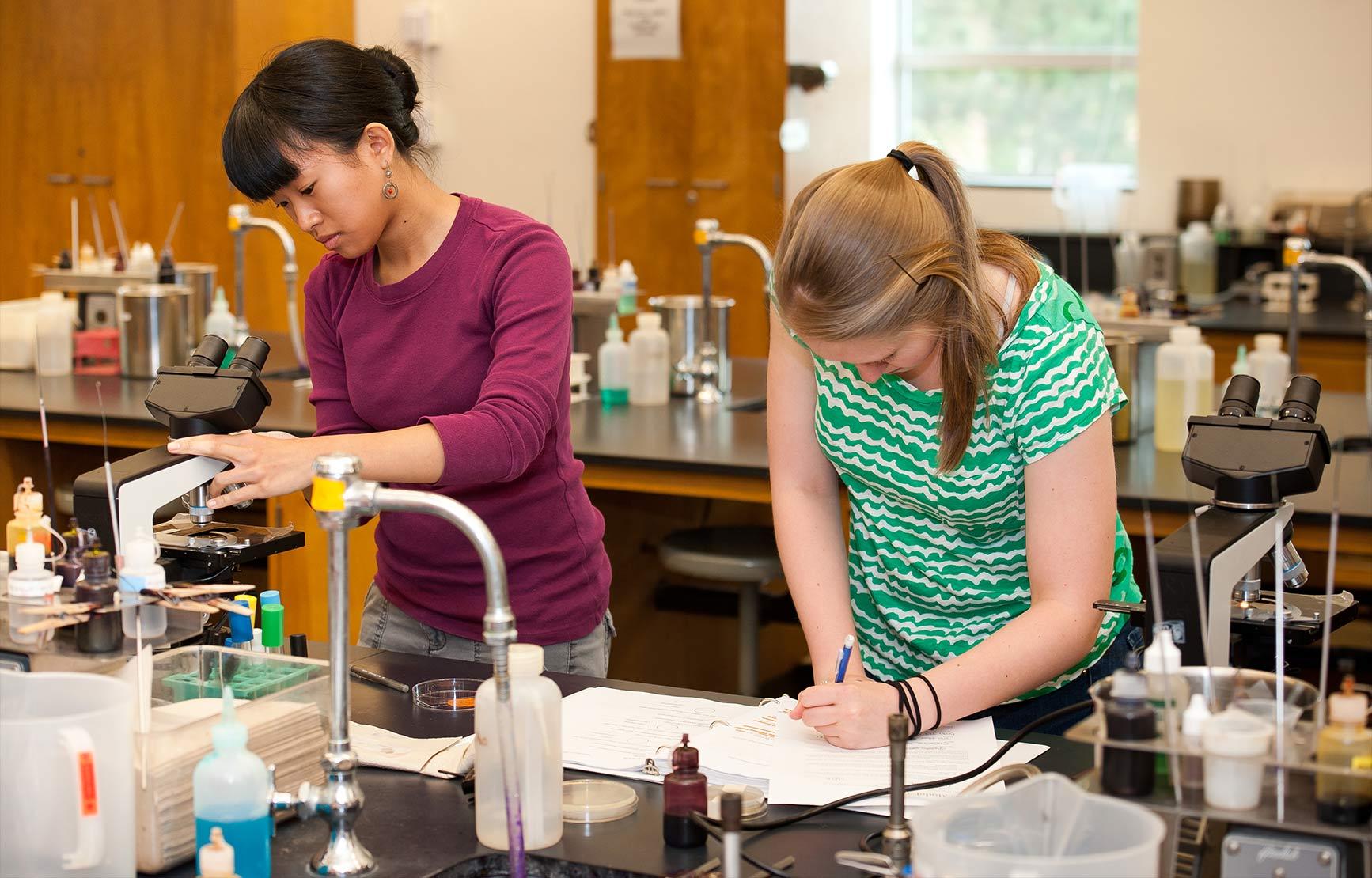 Two students working in a lab.