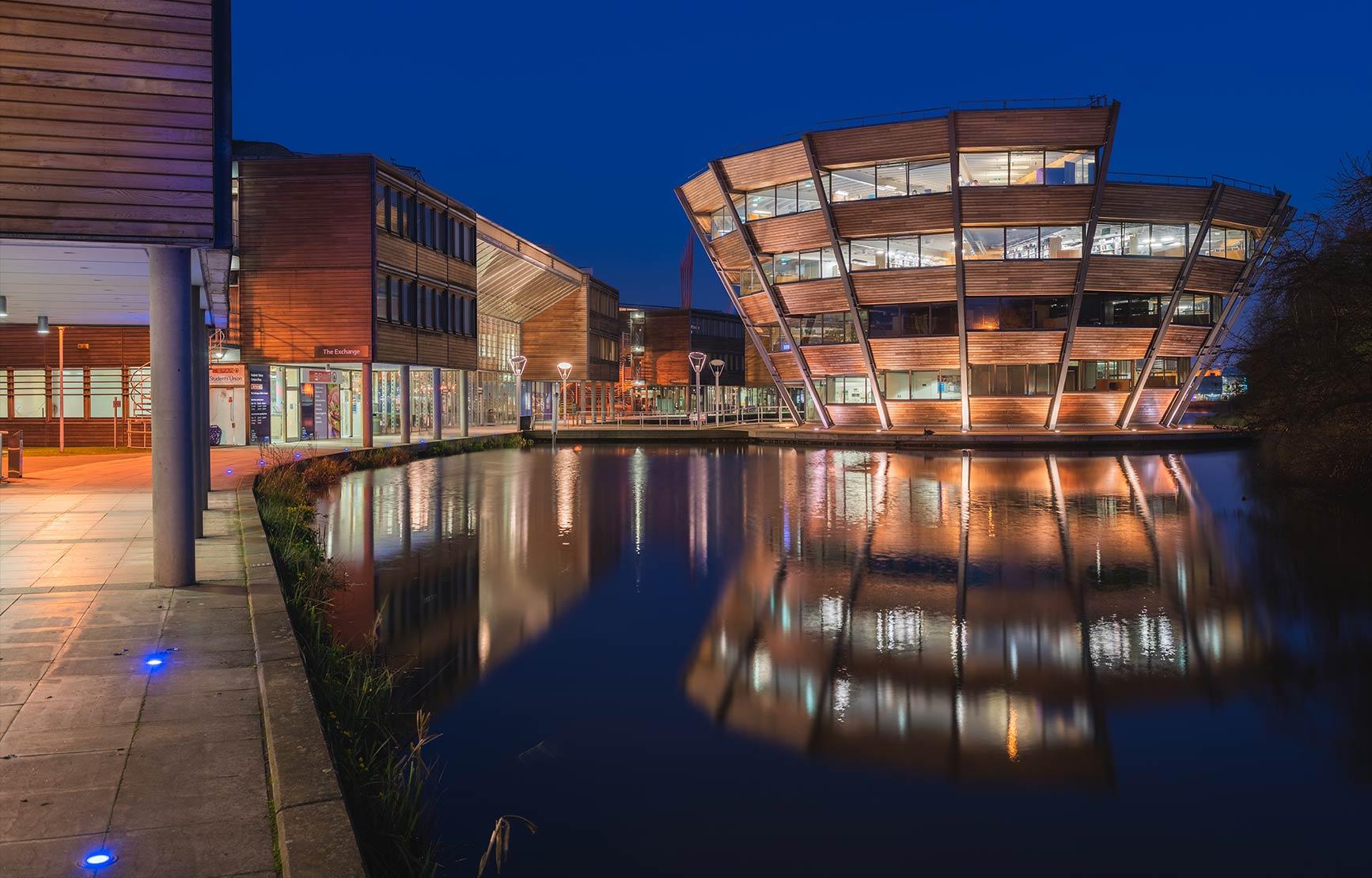 The University of Nottingham Business Building at night.