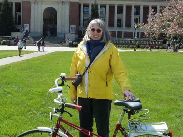 Katharine Field standing with bike in MU quad