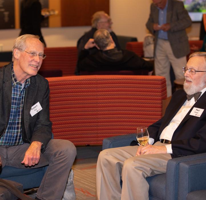 Paul Farber and Robert Nye talking in lobby
